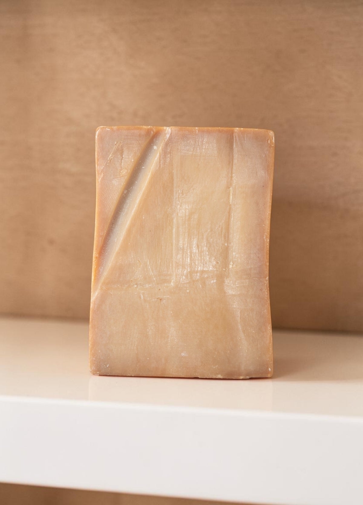 Bera Botanicals 40% laurel berry oil Aleppo soap bar displayed on a warm shelf