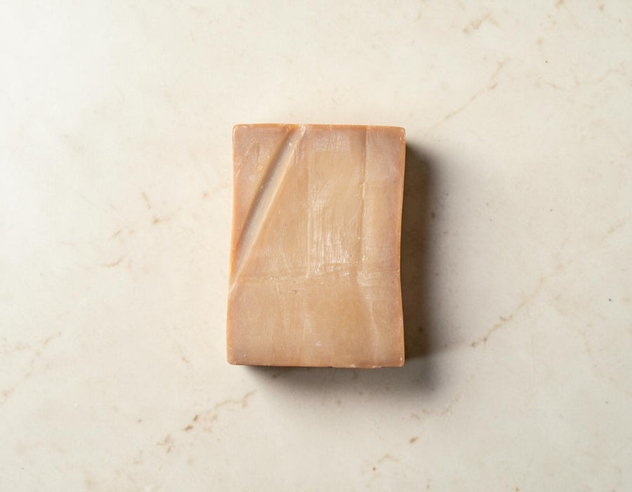Bera Botanicals natural bath essentials arranged with olive branches