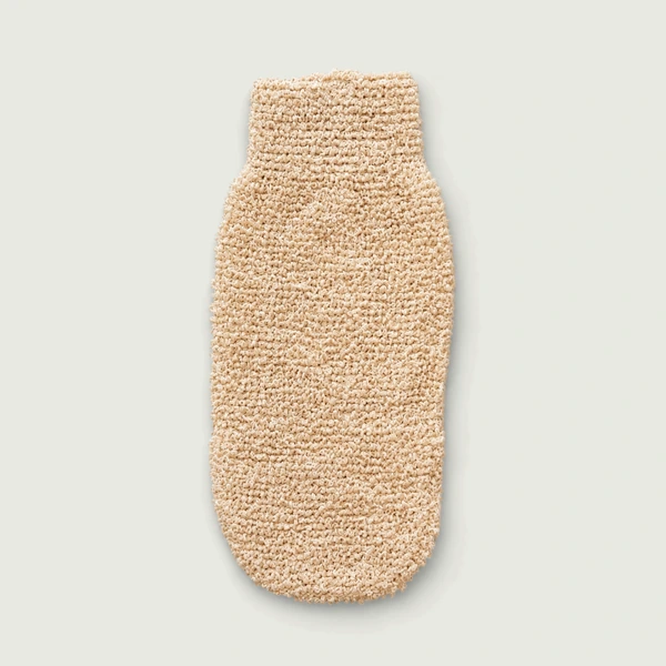 Natural hemp exfoliating mitt on a light neutral background.