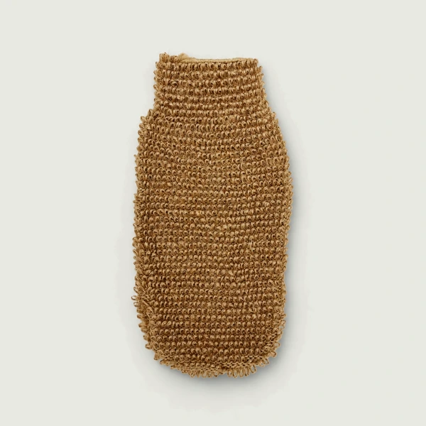 Natural jute exfoliating mitt on a light neutral background.