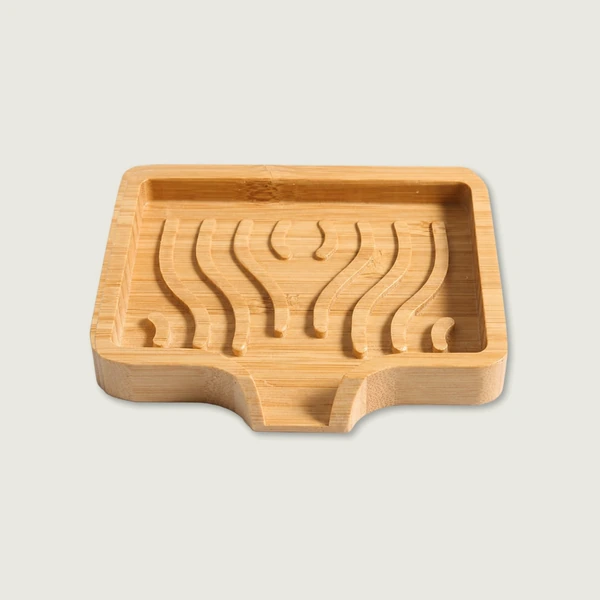 Waterfall bamboo soap dish with curved drainage channels and front spout.